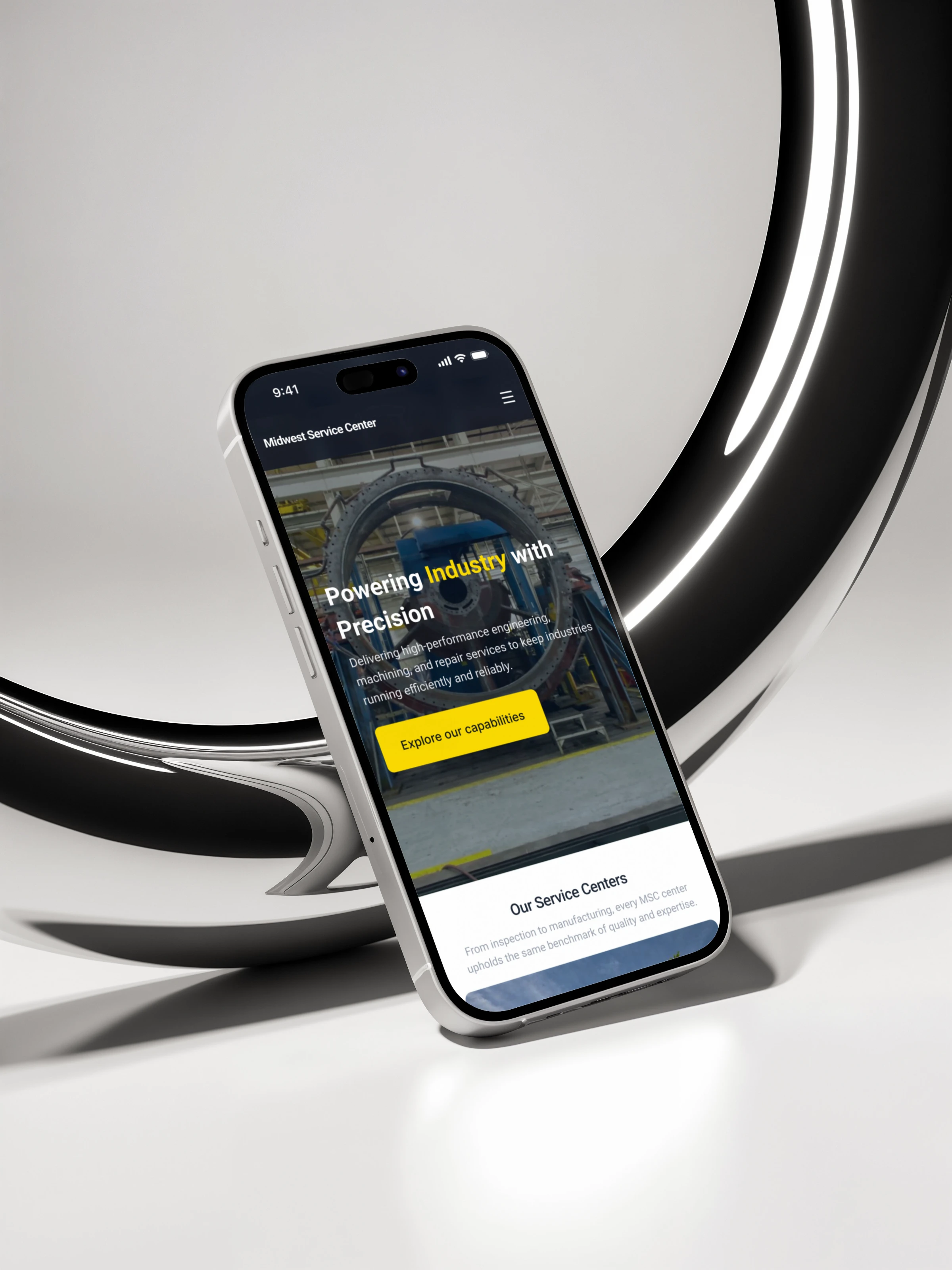 Midwest Service Center website on a phone in front of a large chrome ring